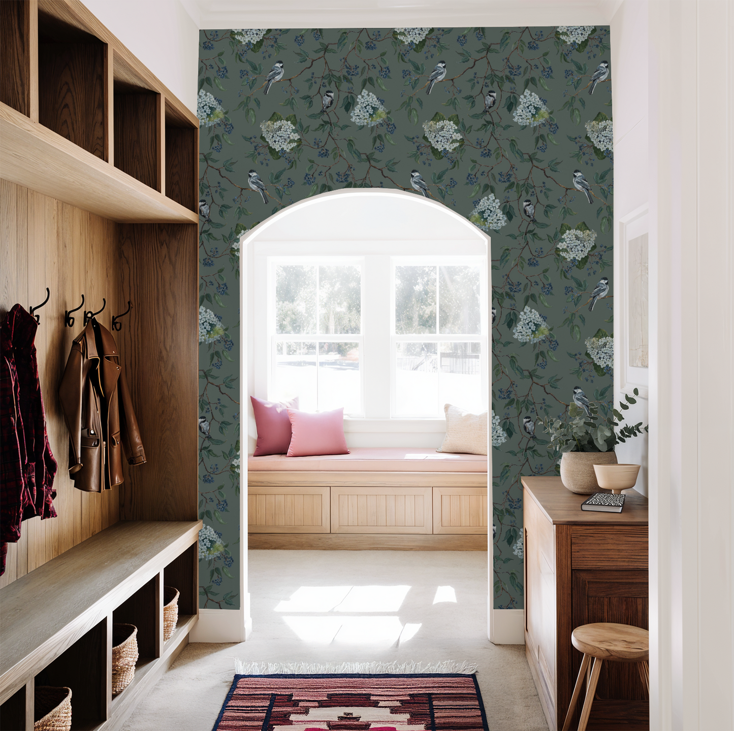 Floral wallpaper with birds in a bright hallway with wooden accents.