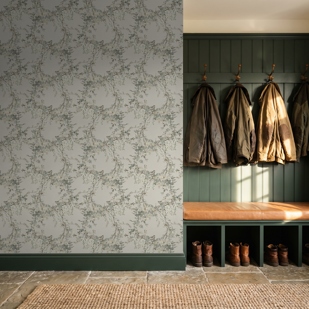 Floral wallpaper with branches and blossoms in a rustic mudroom setting.