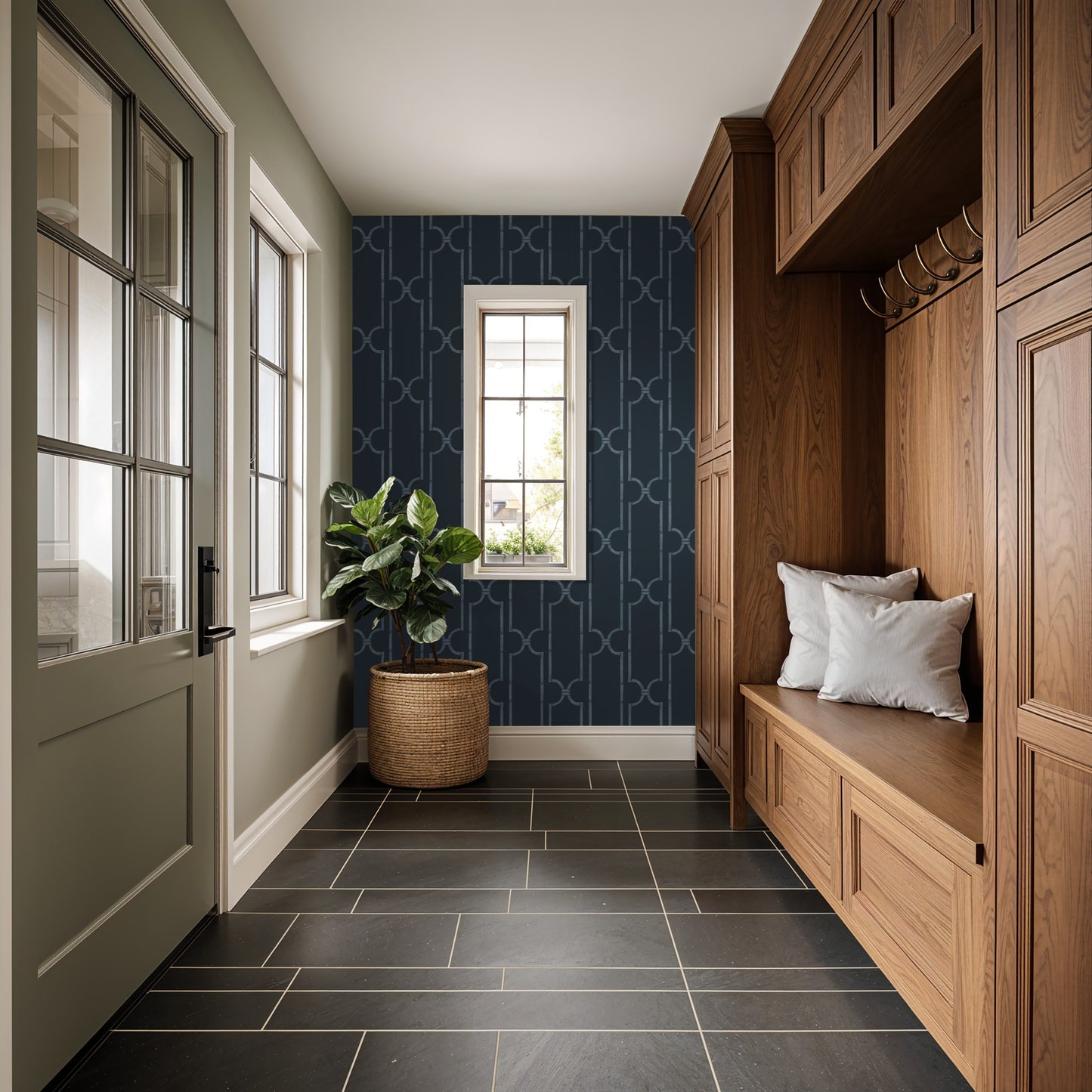 Navy geometric trellis wallpaper in elegant entryway with wooden bench and plant.