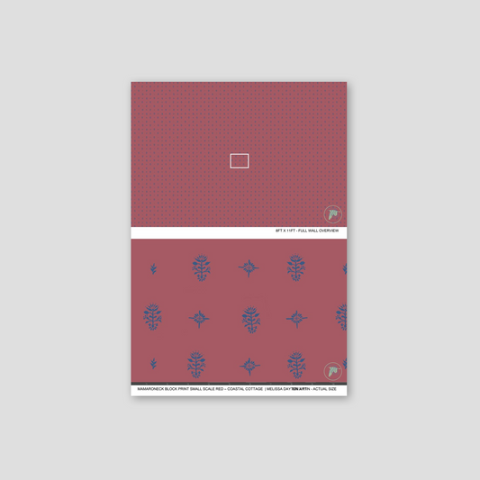 Red notebook with blue floral patterns on a light gray background