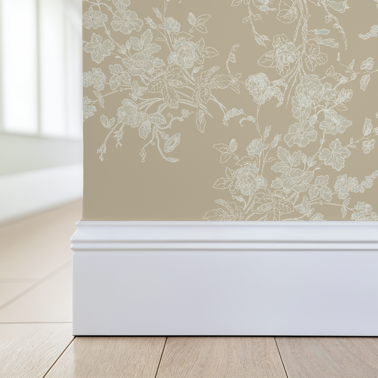 Floral wallpaper with a white baseboard on a neutral wall.