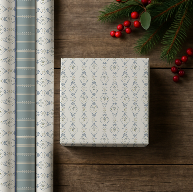 Gift box with decorative paper and holly on a wooden surface