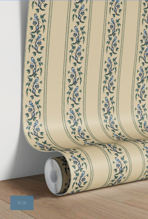 Roll of wallpaper with floral pattern on a wooden surface