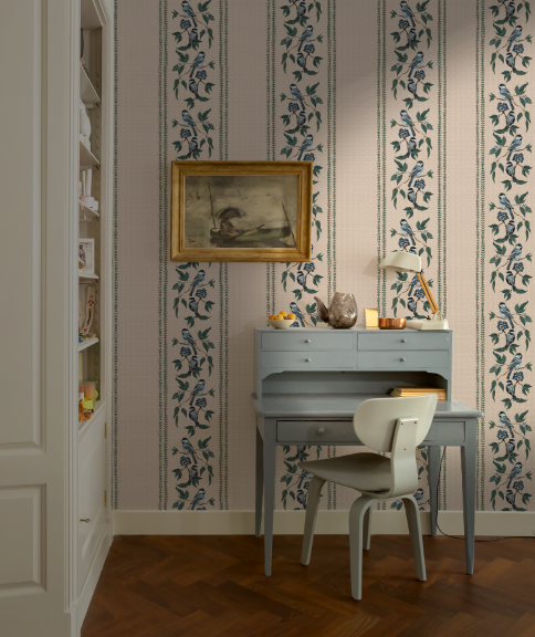 Room interior with a desk, chair, and decorative wall paper