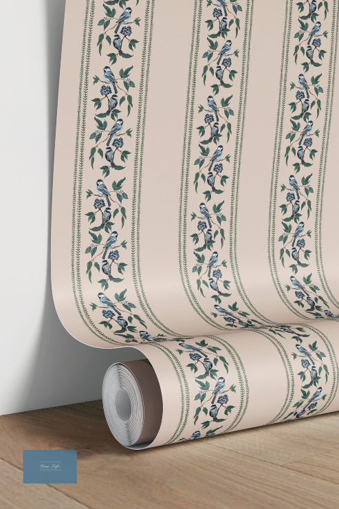 Roll of wallpaper with floral pattern on a wooden floor and white wall.