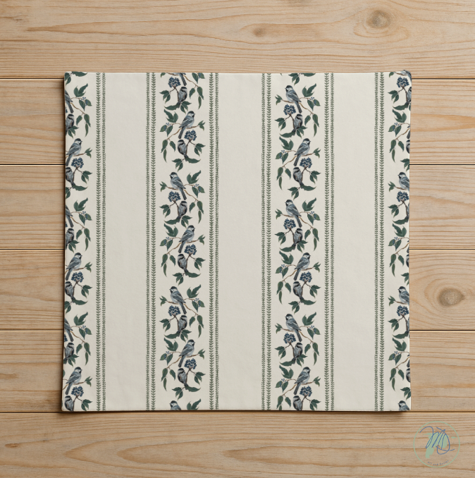 Placemat with bird and floral pattern on a wooden surface