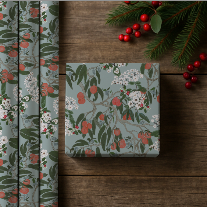 Floral-patterned box on a wooden surface with decorative elements