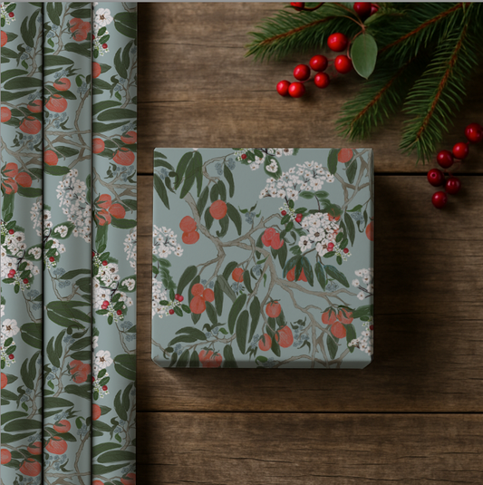 Floral-patterned box on a wooden surface with decorative elements