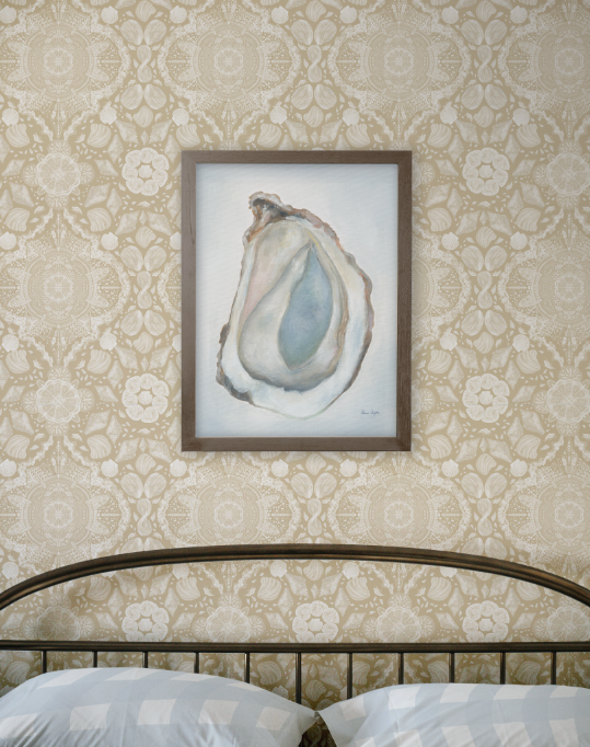 Framed artwork of an oyster shell on a decorative wall with floral patterns.