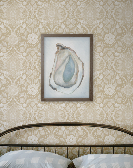 Framed artwork of an oyster shell on a decorative wall with floral patterns.