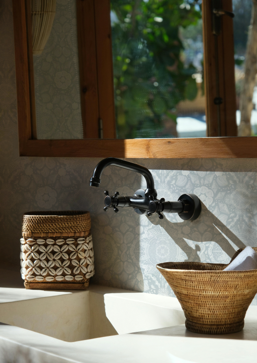 Bathroom sink with wicker basket and decorative elements