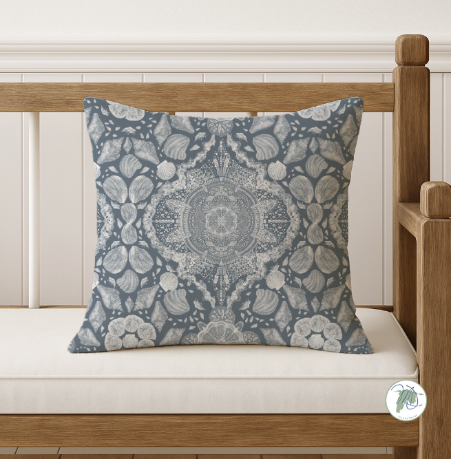 Decorative pillow with a floral pattern on a wooden bench.