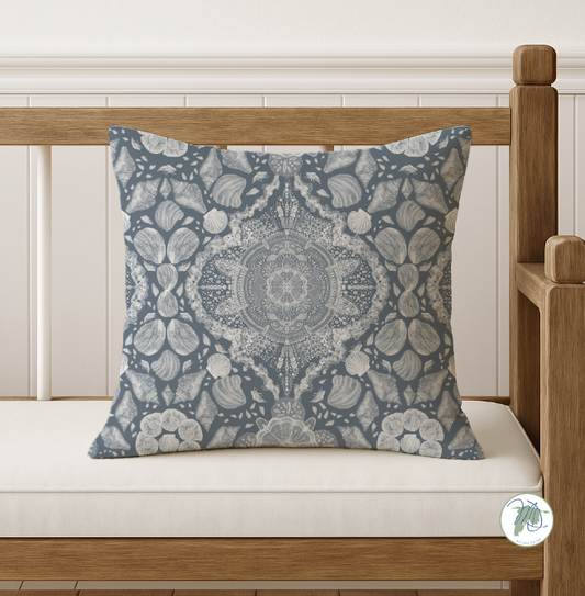 Decorative pillow with a floral pattern on a wooden bench.