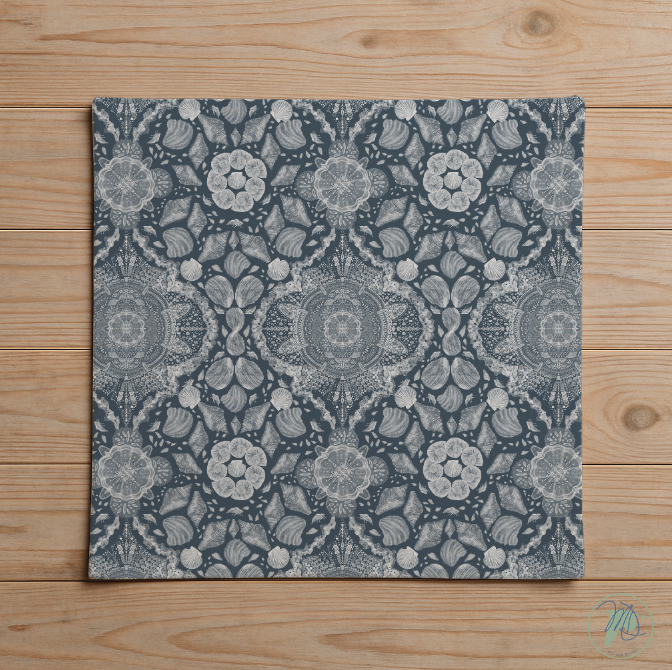 Decorative square mat with floral pattern on a wooden surface