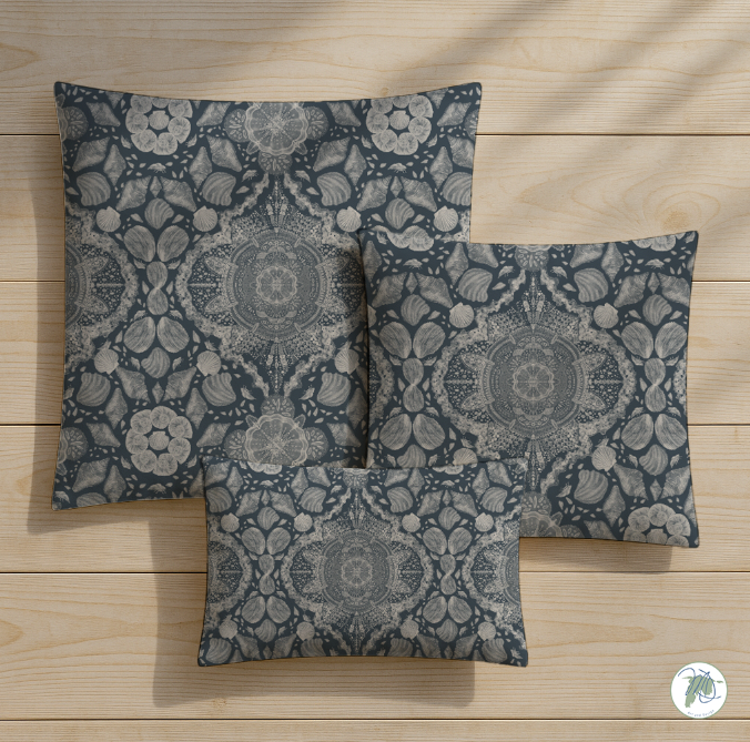 Three patterned pillows on a wooden surface