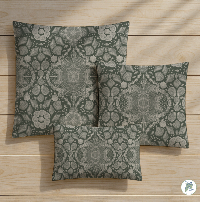 Three patterned pillows on a wooden surface