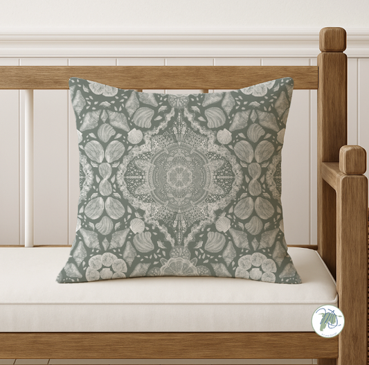 Decorative pillow with a floral pattern on a wooden bench.