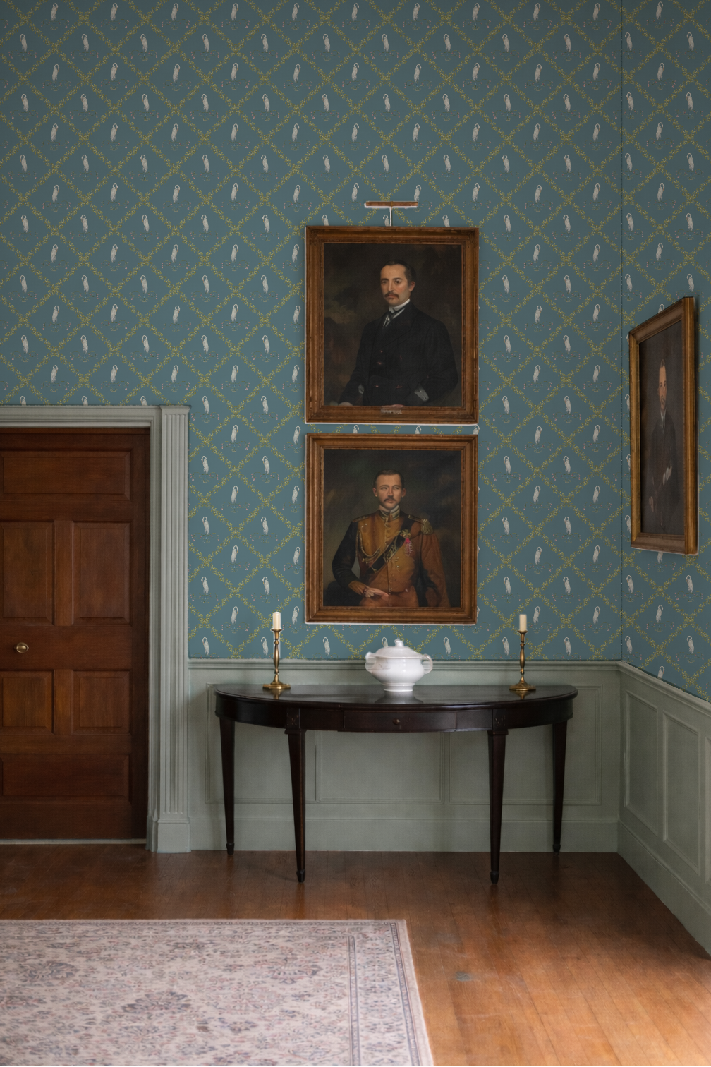 Room with ornate wallpaper, wooden furniture, and portraits on the wall.