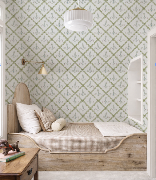 Children's bedroom with patterned wallpaper, wooden bed, and nightstand.