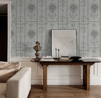 Living room with a sofa, coffee table, and decorative wall paper.