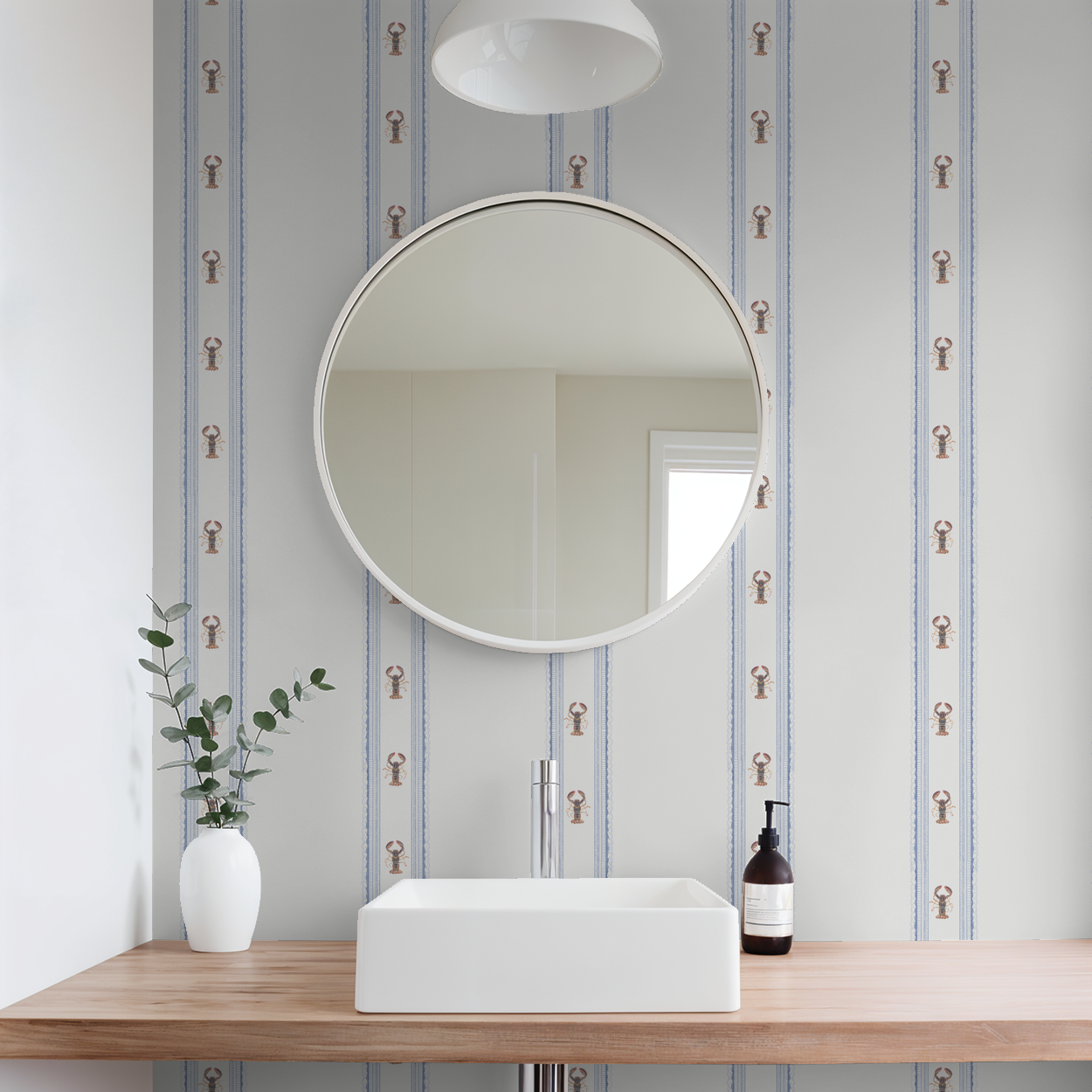 Bathroom with round mirror, sink, and striped wallpaper