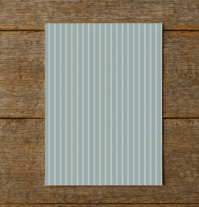 Light blue striped paper on a wooden surface