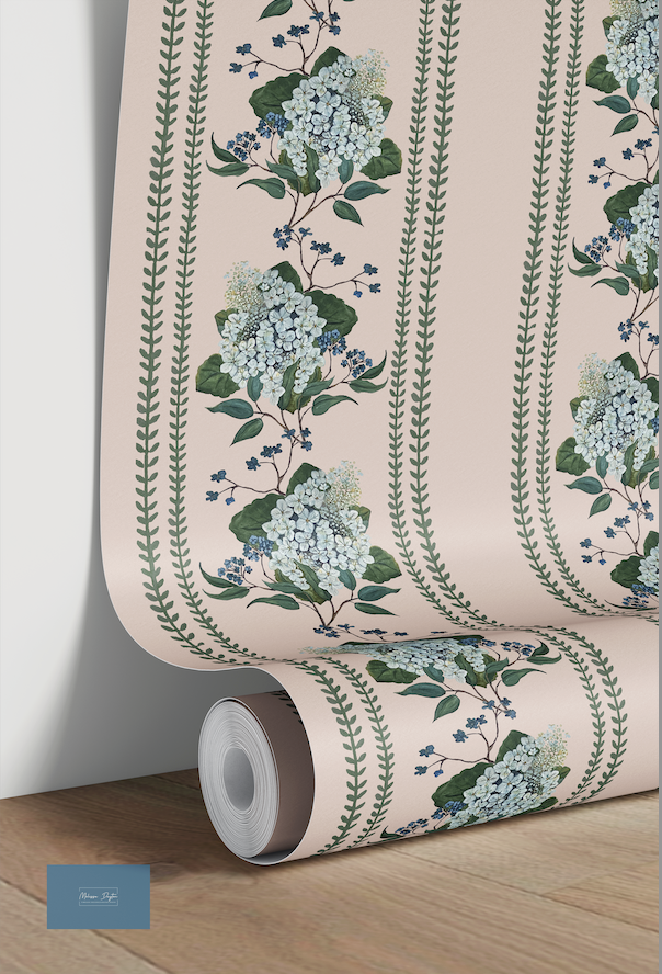 Roll of floral wallpaper with green leaves and blue flowers on a pink background