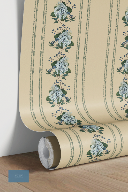 Roll of wallpaper with floral design on a wooden surface