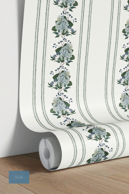 Roll of wallpaper with floral design on a wooden surface