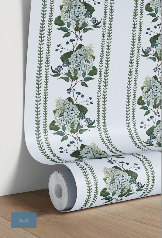 Roll of floral wallpaper with green leaves and white flowers on a plain background
