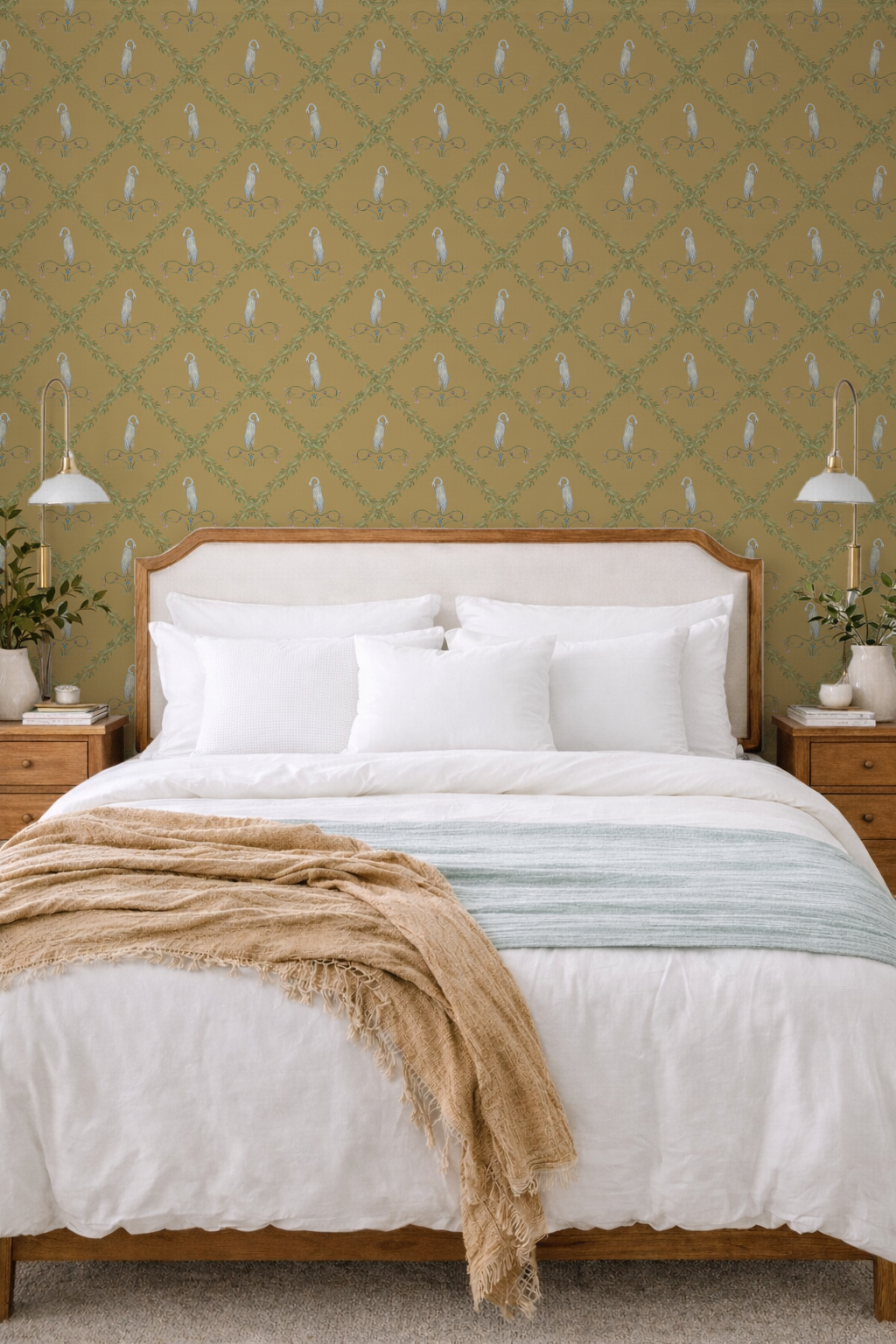 Bedroom with a wooden bed, white bedding, and patterned green wallpaper.