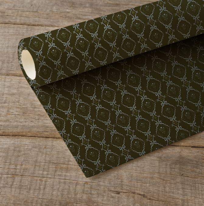 Roll of dark green fabric with a subtle pattern on a wooden surface