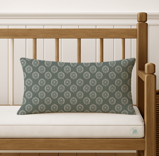 Patterned green pillow on a wooden bed with white bedding