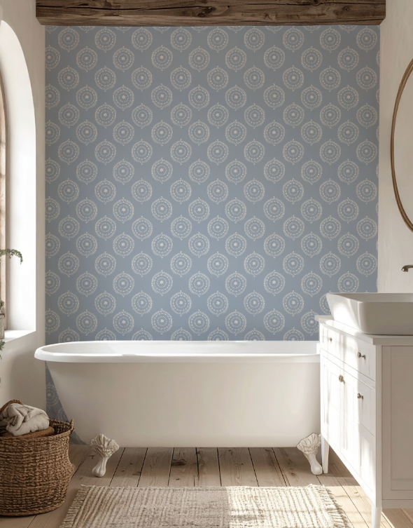 Bathroom with patterned wallpaper, freestanding bathtub, and wooden floor.
