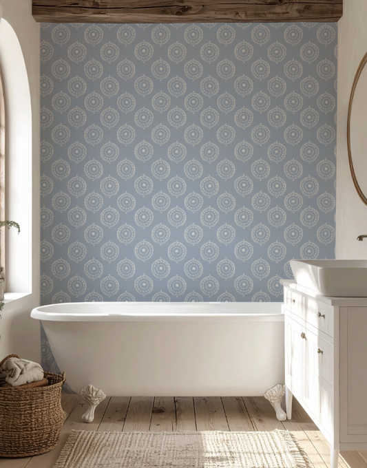 Bathroom with patterned wallpaper, freestanding bathtub, and wooden floor.