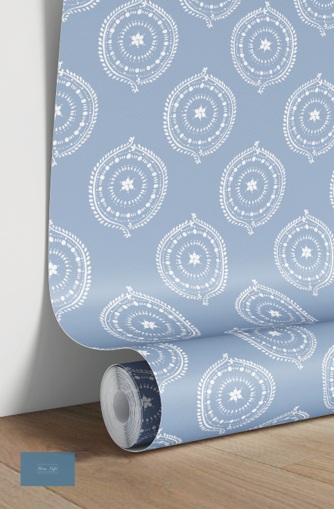 Roll of wallpaper with white circular patterns on a blue background