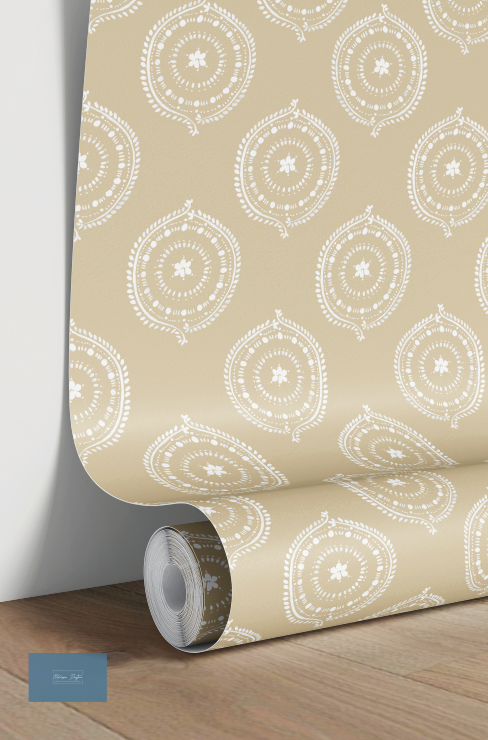Roll of beige yellow wallpaper with white circular pattern on a wooden floor.