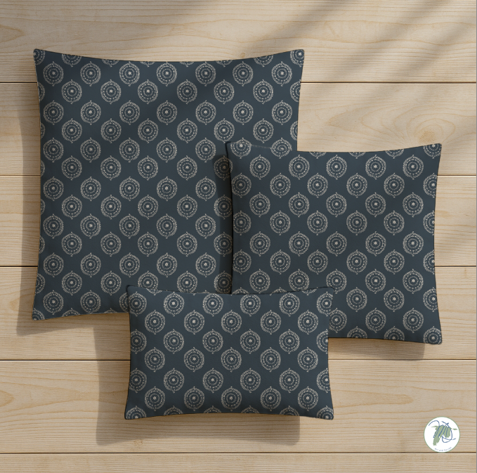 Three patterned pillows on a wooden surface