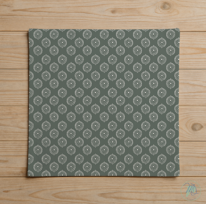 Green fabric with a pattern on a wooden surface