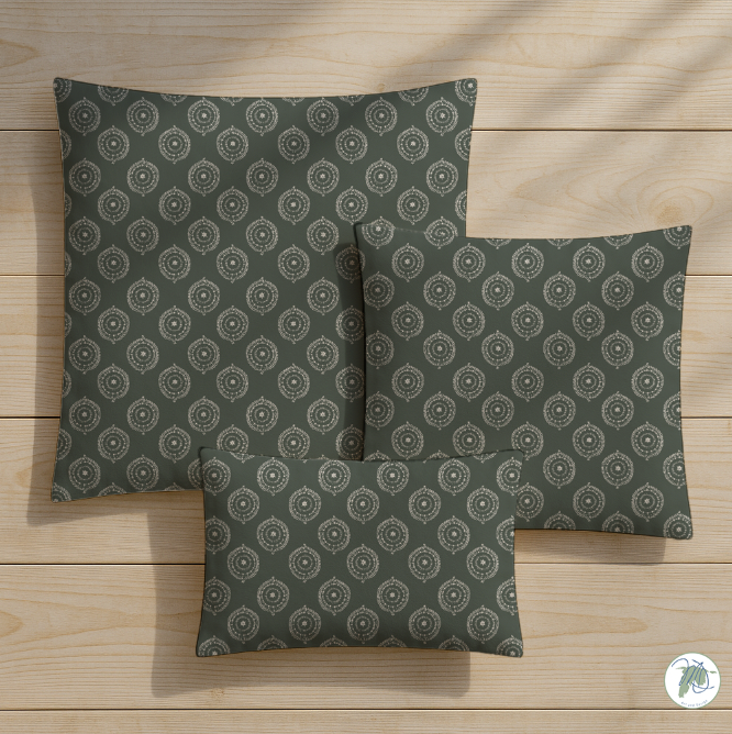Three patterned pillows on a wooden surface