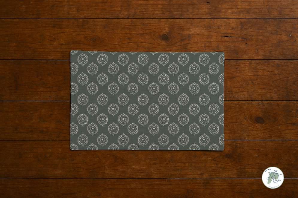 Gray patterned placemat on a wooden surface