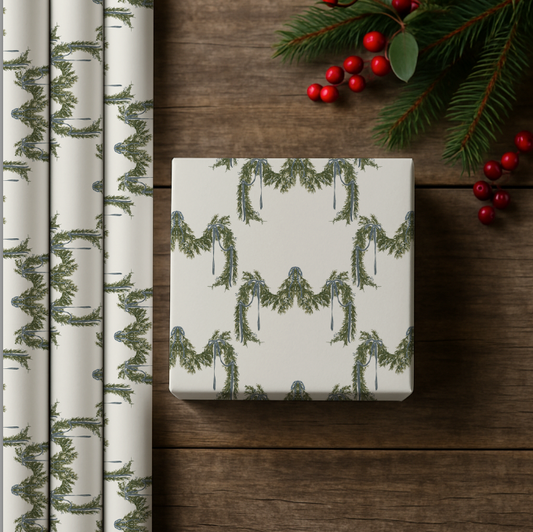 Packaging paper with green leaf pattern on a wooden surface with Christmas decorations.
