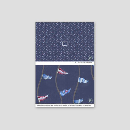 Notebook with a blue cover featuring small white patterns and illustrations of flags on a gray background