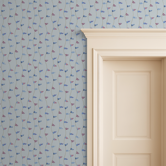 Wallpaper with small flag pattern on a light blue background next to a white door.