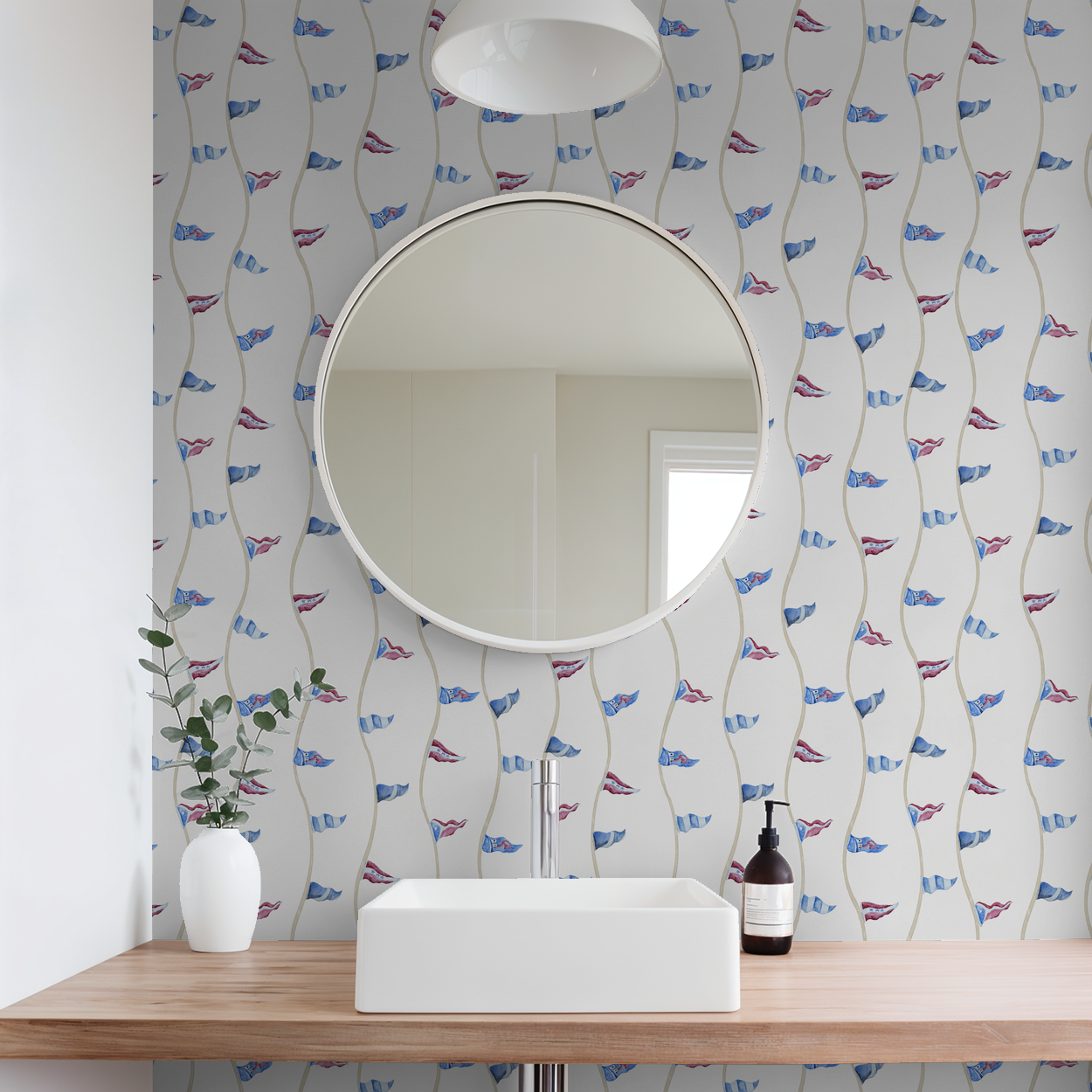 Bathroom with round mirror, sink, and decorative wallpaper