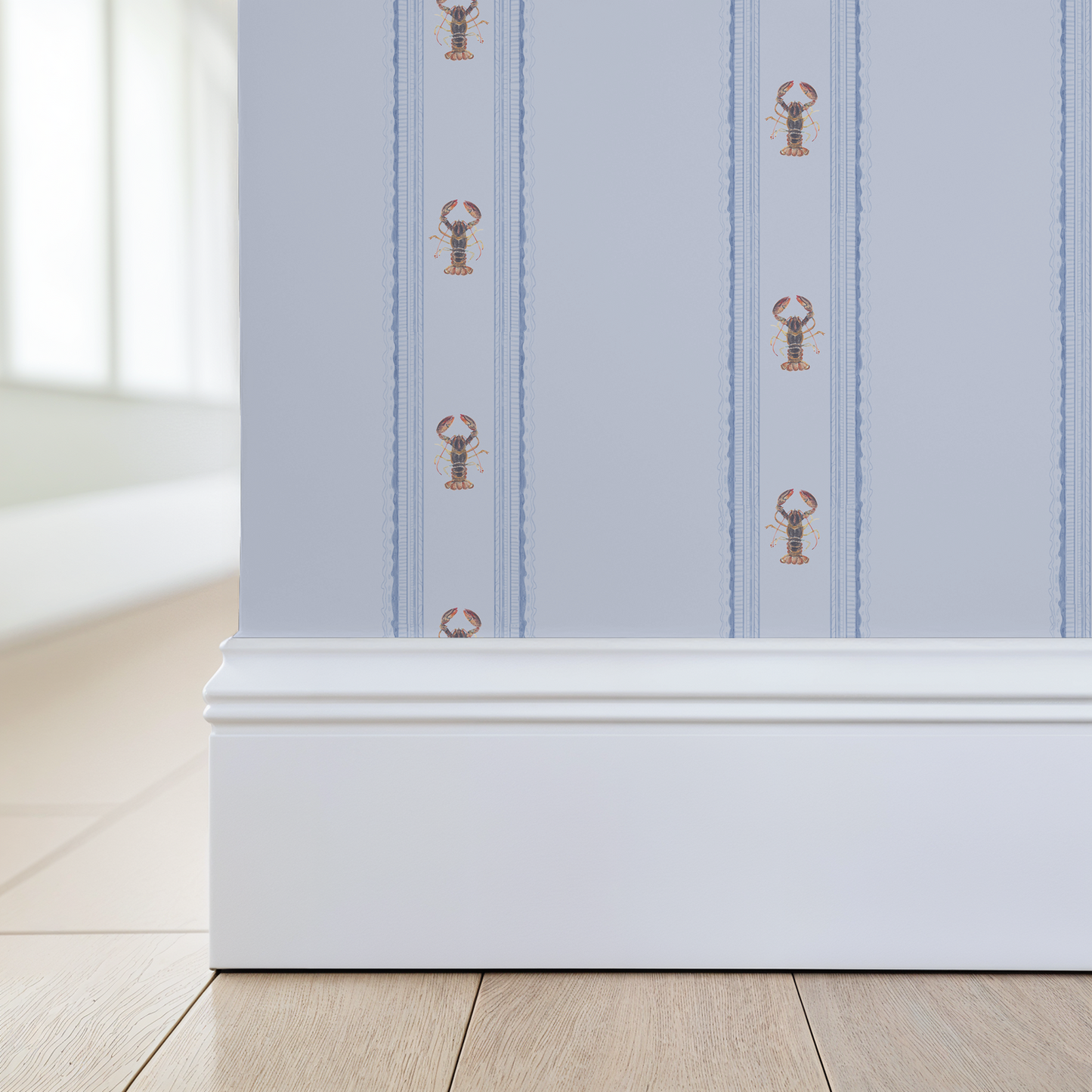 Wallpaper with lobster pattern on a light blue background, applied to a wall.