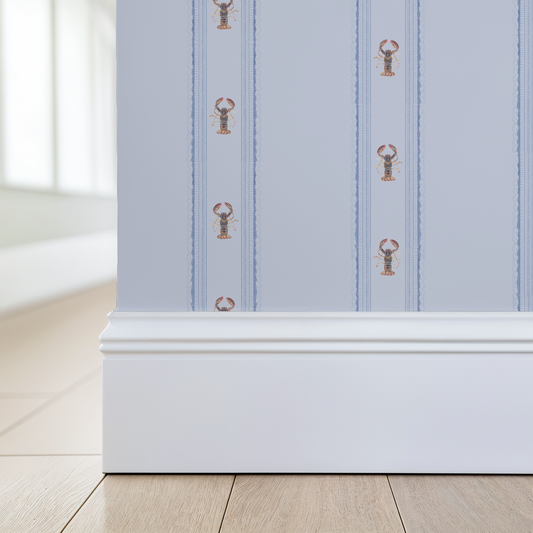 Wallpaper with lobster pattern on a light blue background, applied to a wall.
