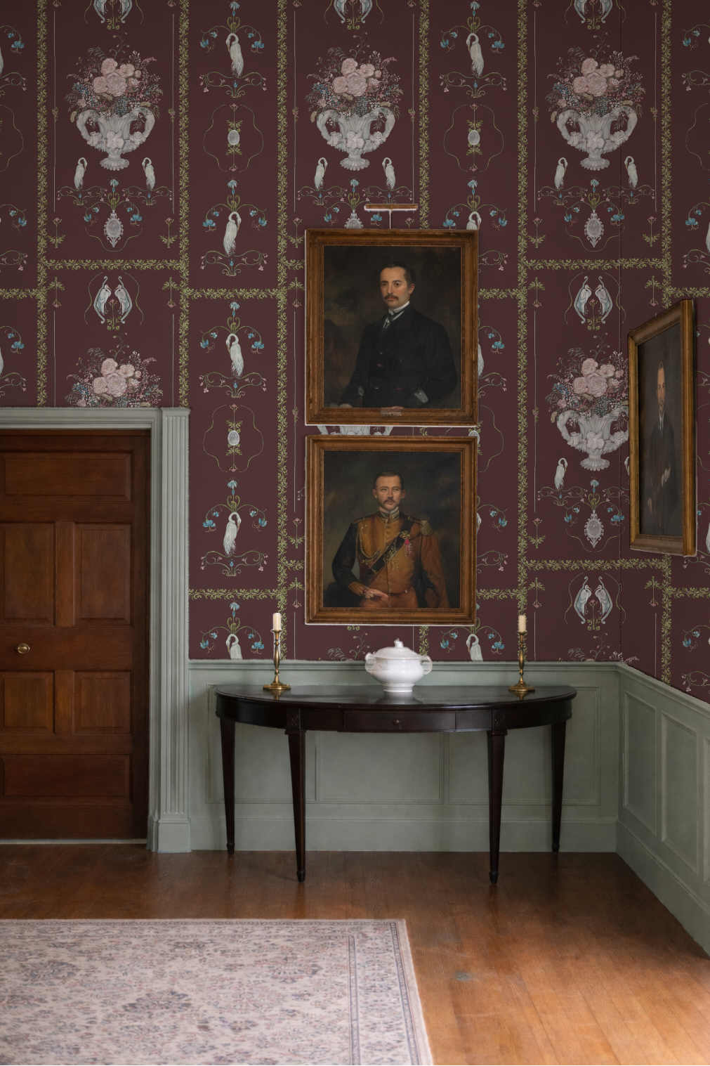 Stately room with ornate wallpaper, portraits, and a console table.