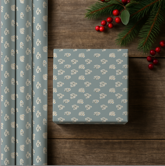 Gift box with floral pattern on a wooden surface with Christmas decorations