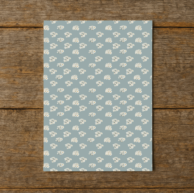 wrapping paper with floral pattern on a wooden surface